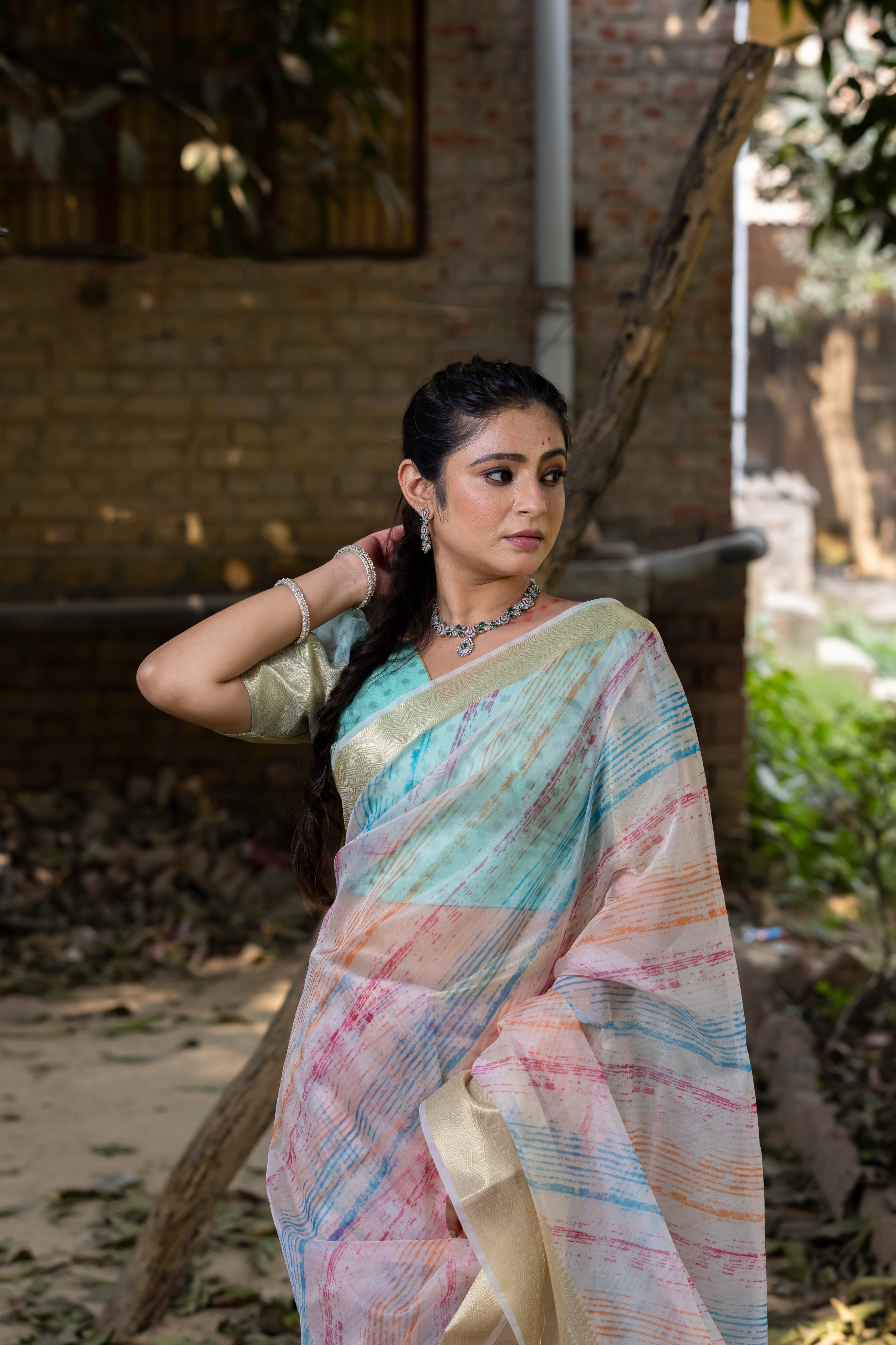 Off White Vibrant Organza Silk Saree with Mesmerizing Digital Print and Zari Border